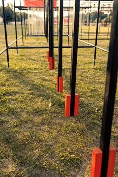 Obstacle course race ocr, hanging pendulum in a row, sunset Stock Photos