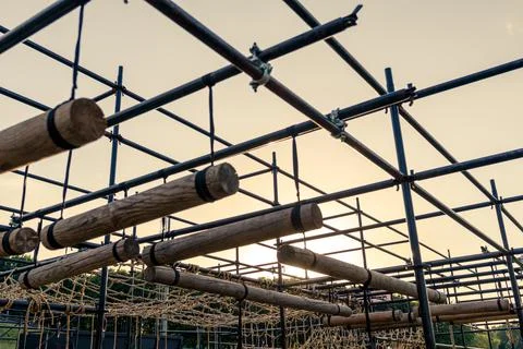 Obstacle course race ocr, horizontal logs in a row, sunset Stock Photos