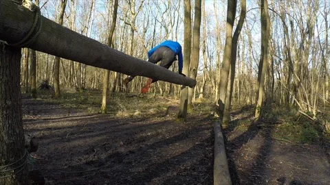 An obstacle course racer jumps over the Sternum Checker Stock Footage 112006385