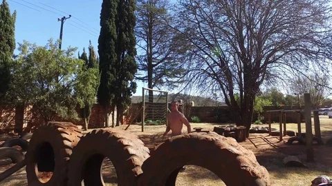 Obstacle Course - Tire jump 2 Stock Footage 98824280
