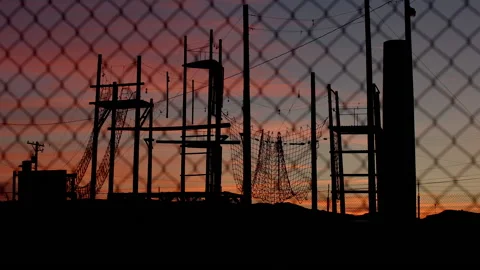 Obstacle Course Training Grounds in Silhouette at Sunset - Shallow DOF Stock Footage 139958600