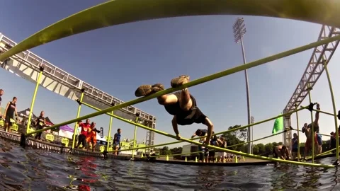 Obstacle Racing low angle pipes over water Stock Footage 171241503