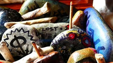 Occult painted Viking drawing patterned spiritual pebbles colourful hobby Stock Footage 158932457