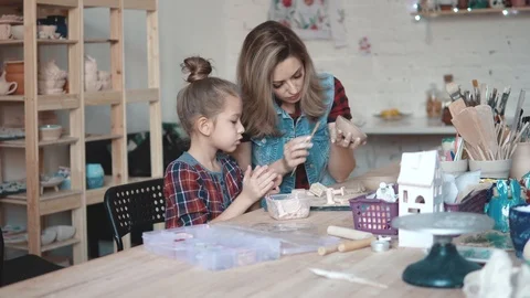 Occupation on modeling of clay in the workshop. a joint pastime of the mother Stock Footage 89978851