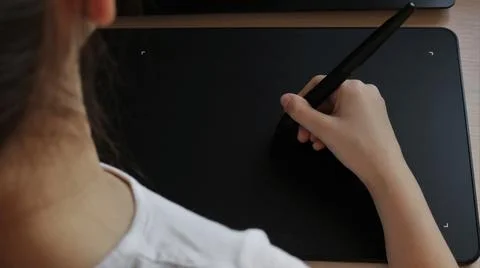 Occupation or creativity using a graphic touching device Stock Photos