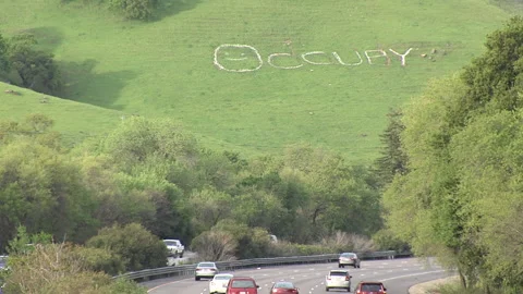 "Occupy" sign visible from freeway Video stock 203593920