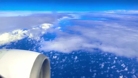 The ocean and clouds overlooking the flying plane Stock Footage 257508558