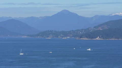 Ocean and mountains view. Blue water and blue skies. Видео 86171462