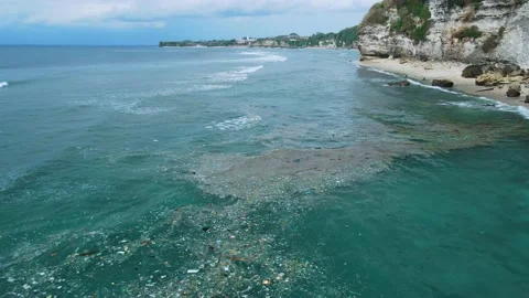 Ocean and plastic pollution in Bali. Pollution by plastic rubbish, Aerial vie Stock Footage 232999538