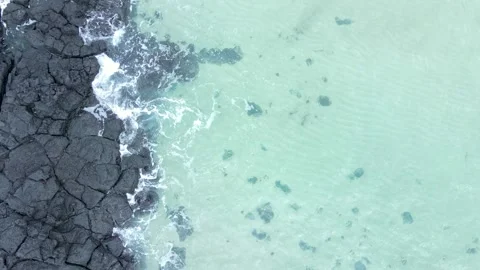 Ocean and volcanic rocks close-up aerial view, natural background. Stock Footage 296571678