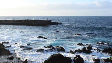 Ocean Atlantic, Waves breaks on dock during a sunny day. HD Video Stock-Footage 98564015