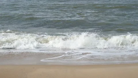 Ocean background live wallpaper. Stormy dark water white sea foam empty sand Stock Footage 203829181