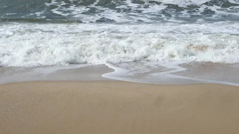 Ocean background live wallpaper. Stormy dark water white sea foam empty sand Stock Footage 204790411
