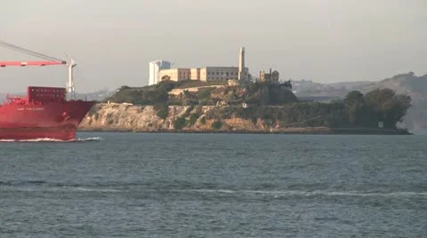 Ocean Barge and Fireboat pass Alcatraz Stock Footage 10585789
