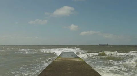 Ocean bay with ship passing by Stock Footage 52744967