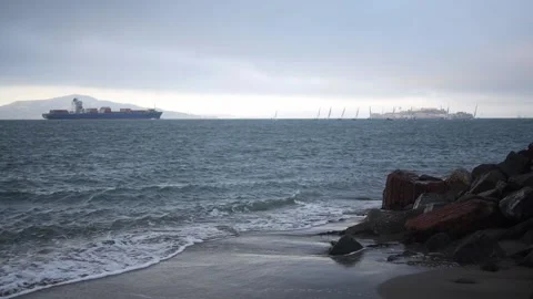 Ocean Bay waves and Container Ship Stock Footage 142245701