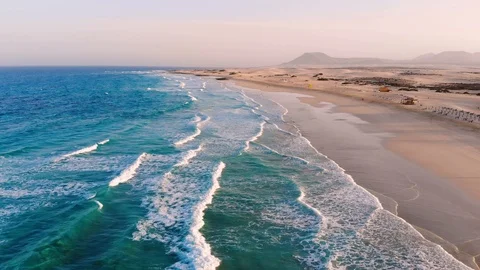 Ocean beach aerial view from drone with waves breaking on sandy coast Stock Footage 105352030