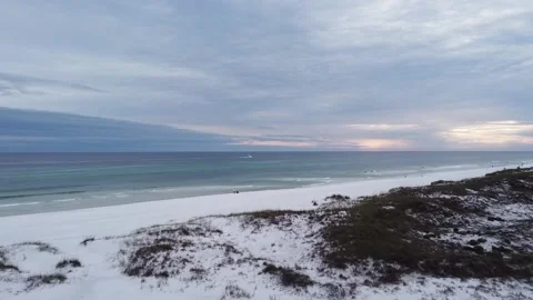 Ocean Beach shot of drone flying over the dunes to the ocean with boat going by Stock Footage 160131106