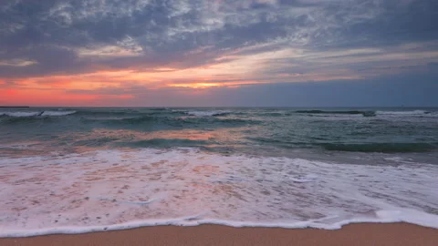 Ocean beach sunrise and dramatic colorful sky clouds Stock Footage 139209031