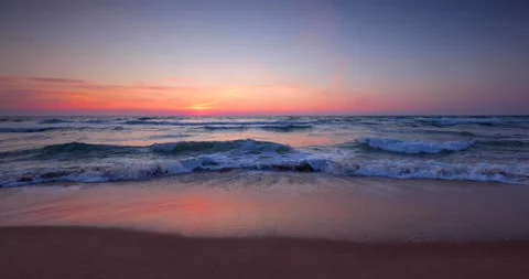 Ocean beach sunrise and dramatic colorful sky clouds, 4K Video Stock Footage 151238445