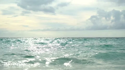 Ocean beach sunrise and dramatic colorful sky clouds. Sea water in low angle Stock Footage 175111067