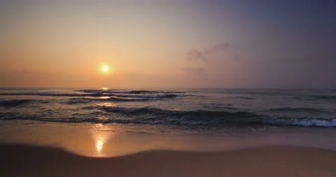 Ocean beach sunrise. Waves splash on the shore Stock Footage 140401153