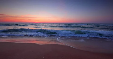 Ocean beach sunrise. Waves splash on the shore Stock Footage 140492571