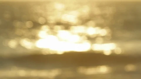 Ocean beach sunset. Out of focus sun on the water A Stock Footage 102403126