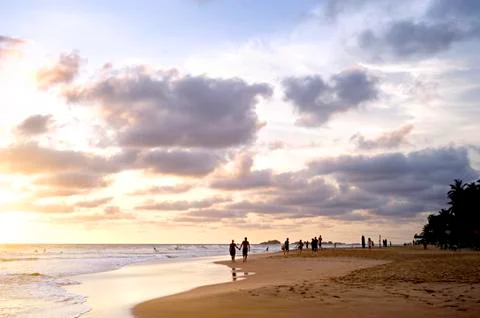 Ocean beach at sunset Stock Photos