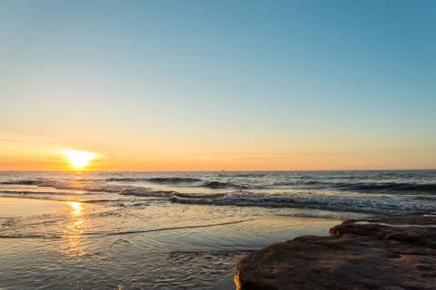 Ocean beach at the sunset Stock Photos