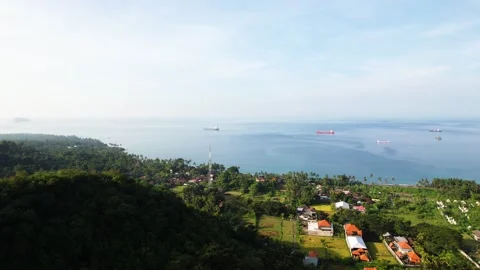 Ocean, beach, temple above the ocean | Bali, Indonesia | 4K video Stock Footage 197928237