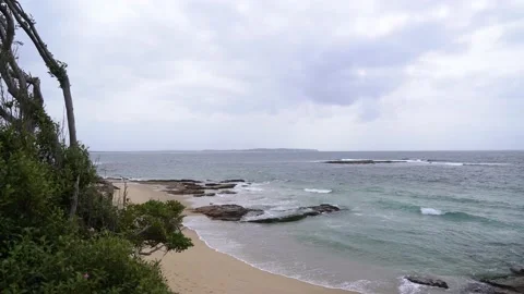 The ocean beach under grey sky Stock Footage 130368630