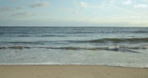 Ocean beach wave dolly tracking shot Stock Footage 57369395