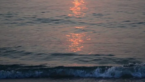 Ocean beach waves on beach at sunrise. Stock Footage 76690757