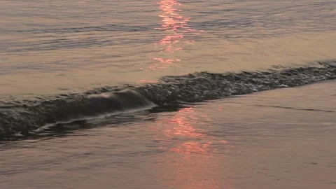 Ocean beach waves on beach at sunset. Video stock 220477237