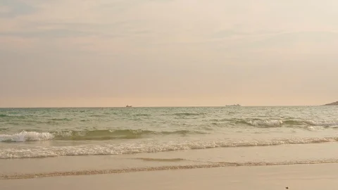 Ocean beach waves on tropical beach at sunset time, sunlight beautiful evening. Stock Footage 112152879