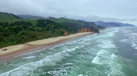 Ocean beach on a windy, cloudy  mourning with many waves Stock-Footage 52134580