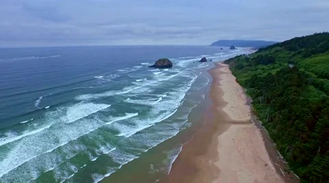 Ocean beach on a windy, cloudy  mourning with many waves Stock Footage 52135108
