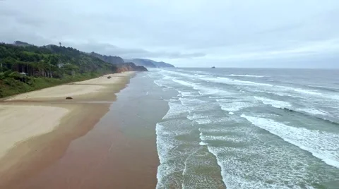 Ocean beach on a windy, cloudy  mourning with many waves Stock Footage 52137239