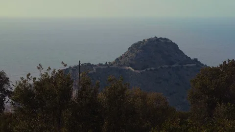 Ocean behind a small hill in Sicily Stock Footage 88722259