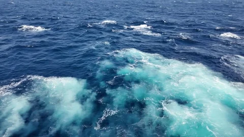 Ocean Blue Ocean Waves With Ripples and Sparkling Sunlight Reflections Stock Footage 313889602