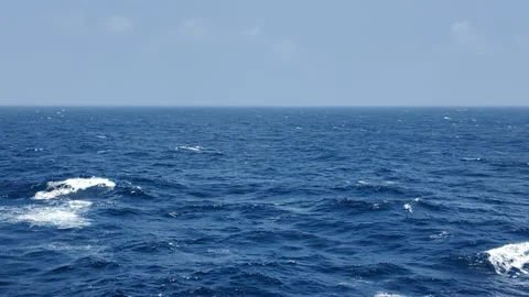 Ocean Blue Ocean Waves With Ripples and Sparkling Sunlight Reflections Stock Footage 313889628