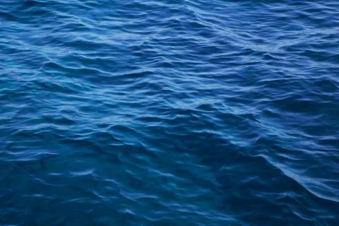 Ocean: blue water background - empty natural surface. Stock Photos