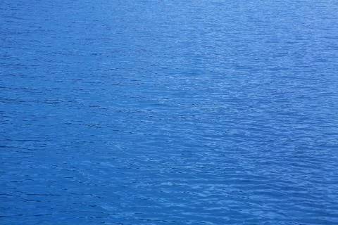Ocean: blue water background - empty natural surface. Stock Photos