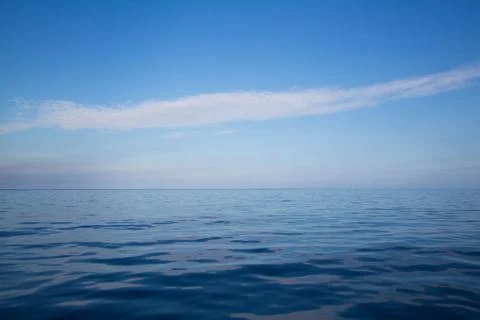 Ocean: blue water background - empty natural surface. dreams concept with hor Stock Photos