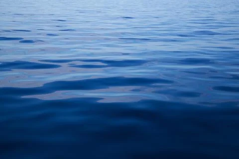 Ocean: blue water background - empty natural surface. Stock Photos