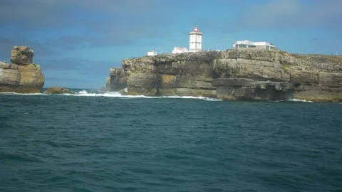Ocean blue waves break on high cliff Stock Footage 169415682