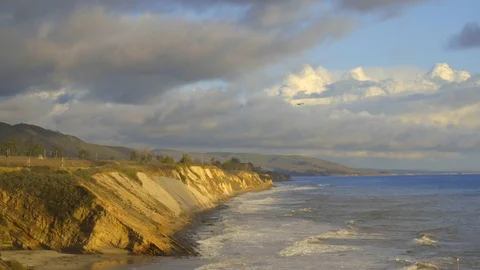 Ocean bluffs and waves during golden hour Stock Footage 119794715