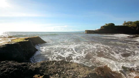 Ocean breeze waves on the rocks of Bali Video stock 48667990