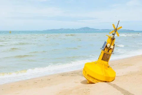 Ocean buoy environment sensor with CCTV camera out of service rest at sand .. Foto stock